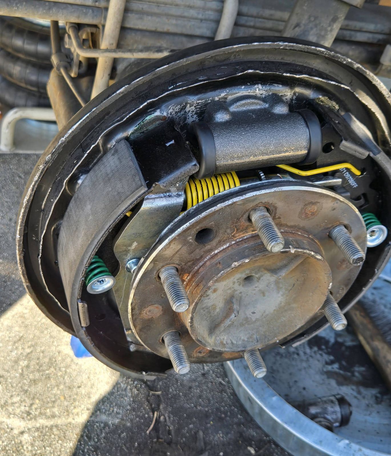 Rear drum brake shoes, springs and wheel cylinder on a 2011 Toyota Tacoma in Ventura